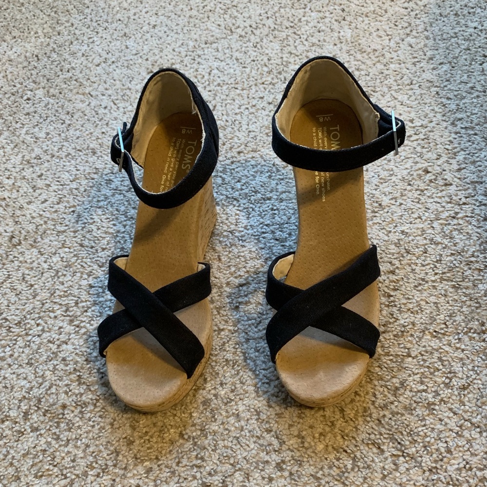 Black wedge Toms.